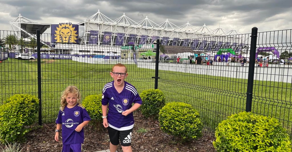 My kids outside the stadium, waiting for the match to start